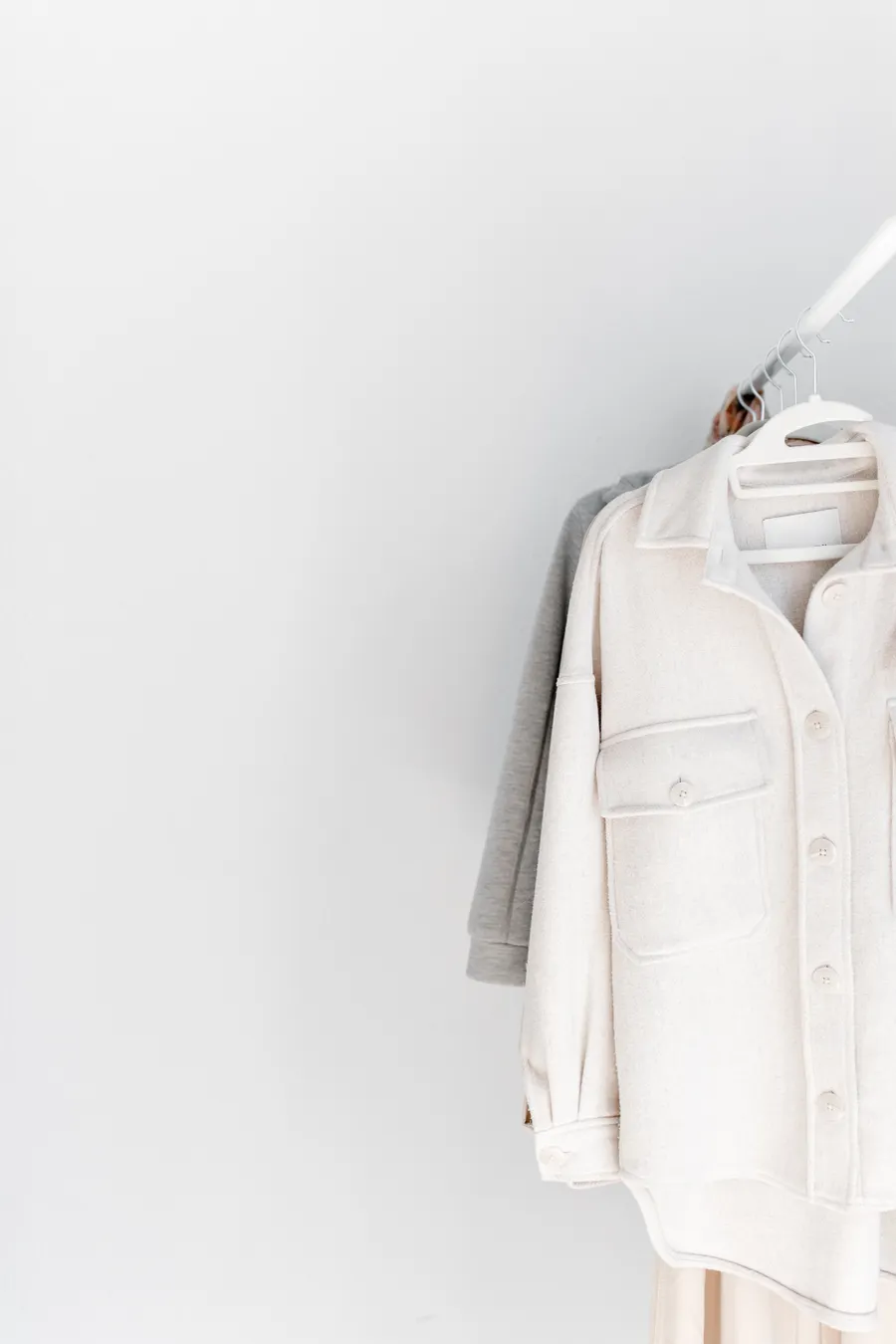 A short rail of neutral-toned clothing